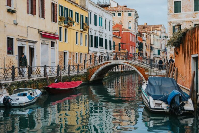 Free photo of charming venetian canal with colorful buildings and boats.jpeg